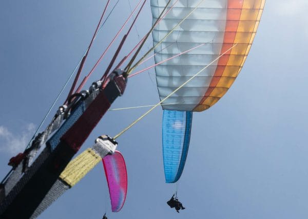 three paragliders