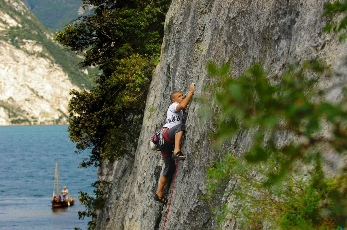 climber on a slab on the lake