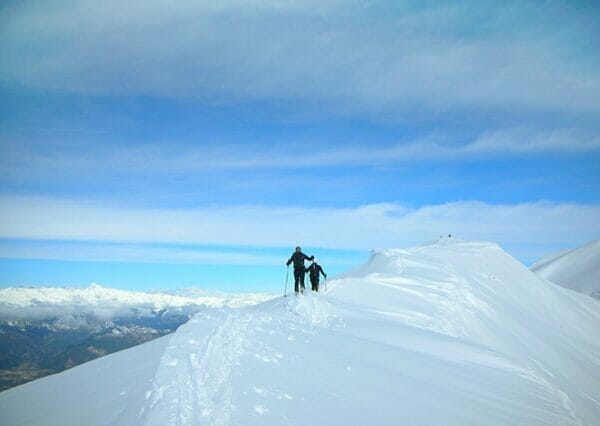 ski tourer over cima costabella