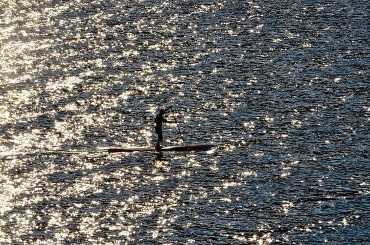 shiny lake with sup